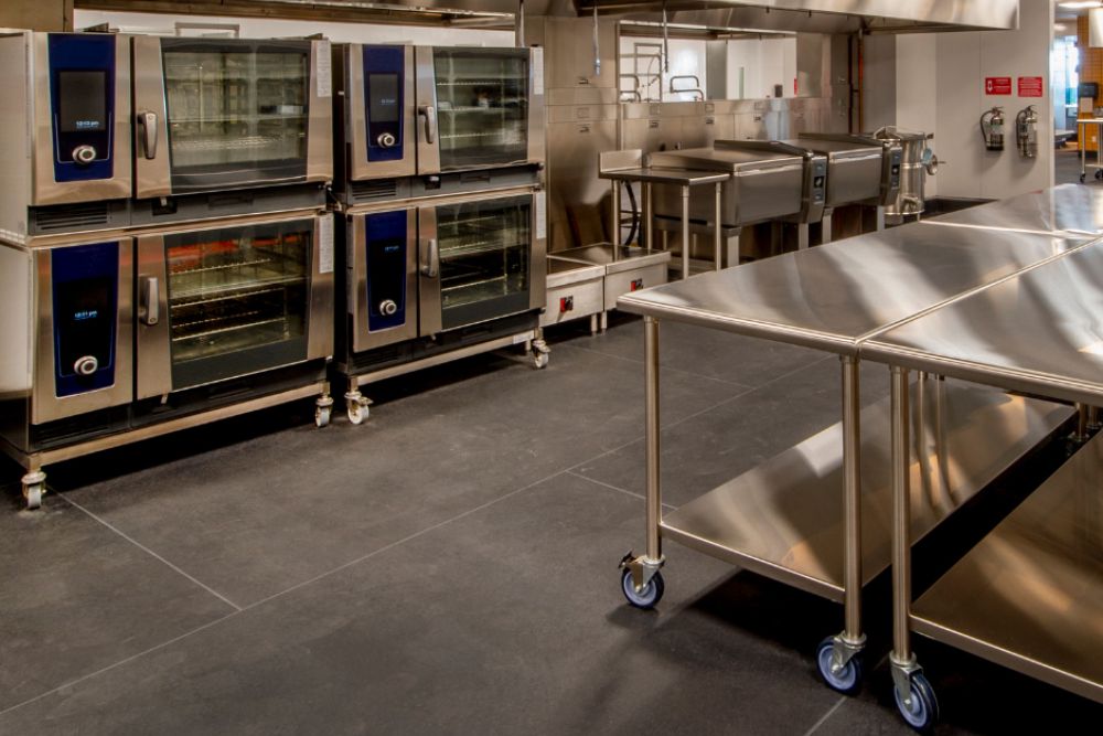 A well-equipped commercial kitchen showcasing stainless steel appliances, linked to a repair service in Spokane, WA.